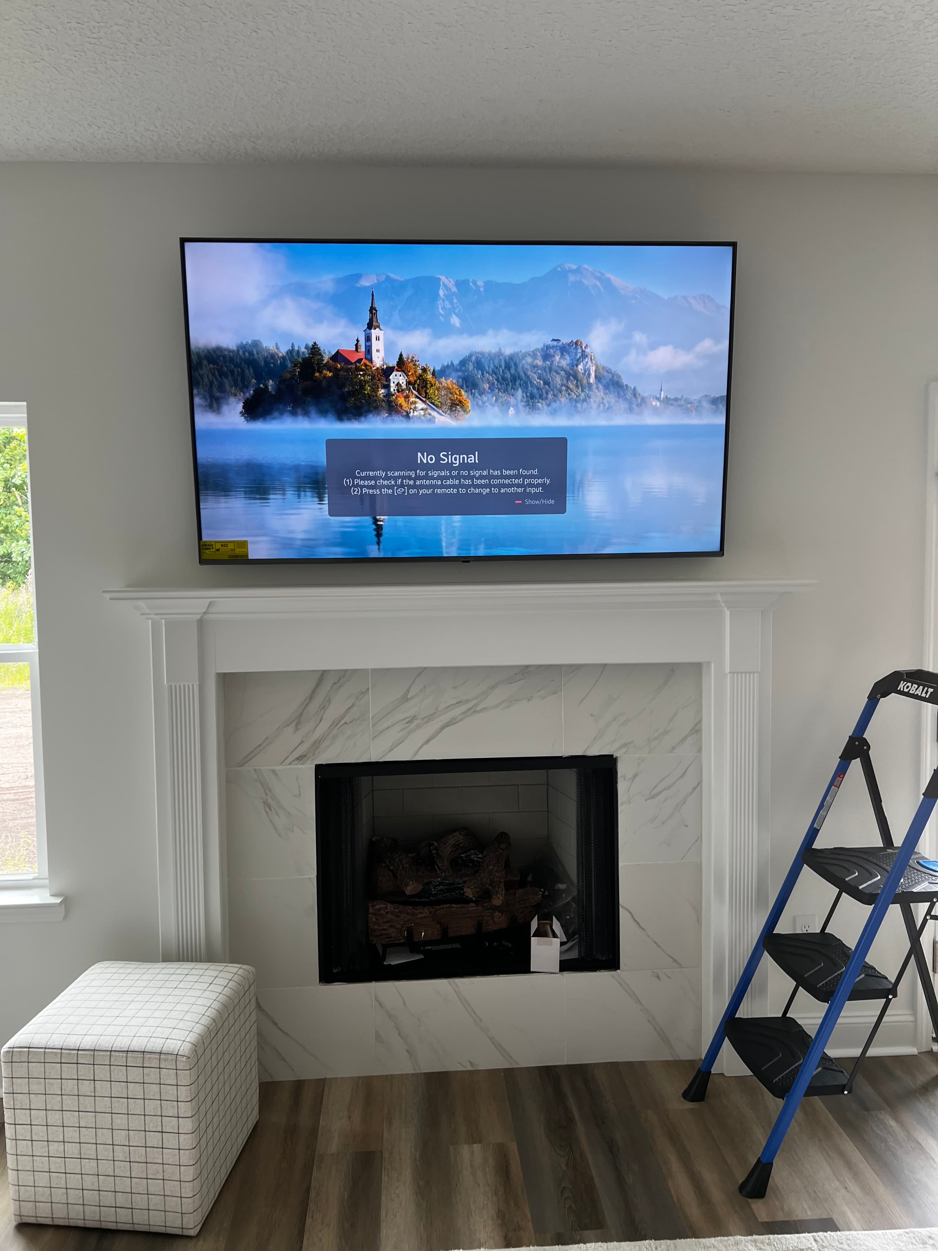 TV mounted over a fireplace during a weekend handyman visit in Hinesville