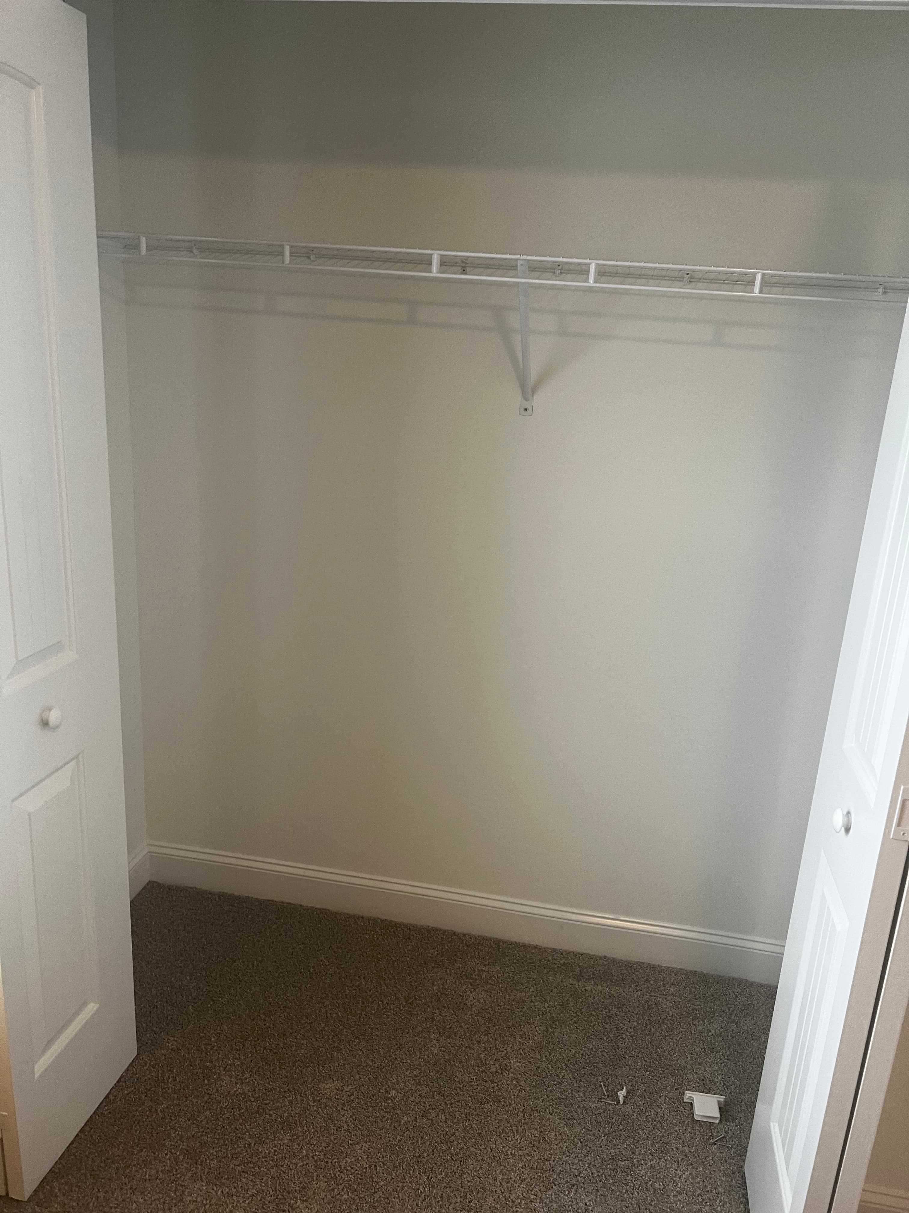 Closet with wire shelving before remodel